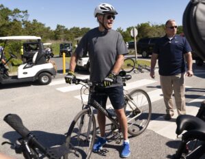 Read more about the article Watch President Joe Biden ‘get foot caught,’ fall off bike near beach home as crowd swarms